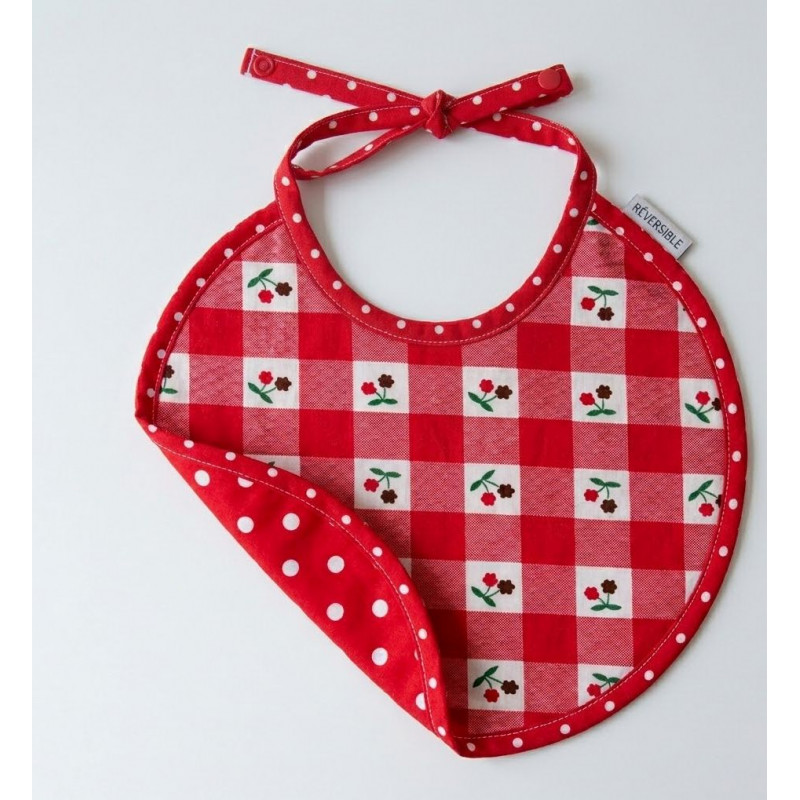 Bavoir rouge à fleurs